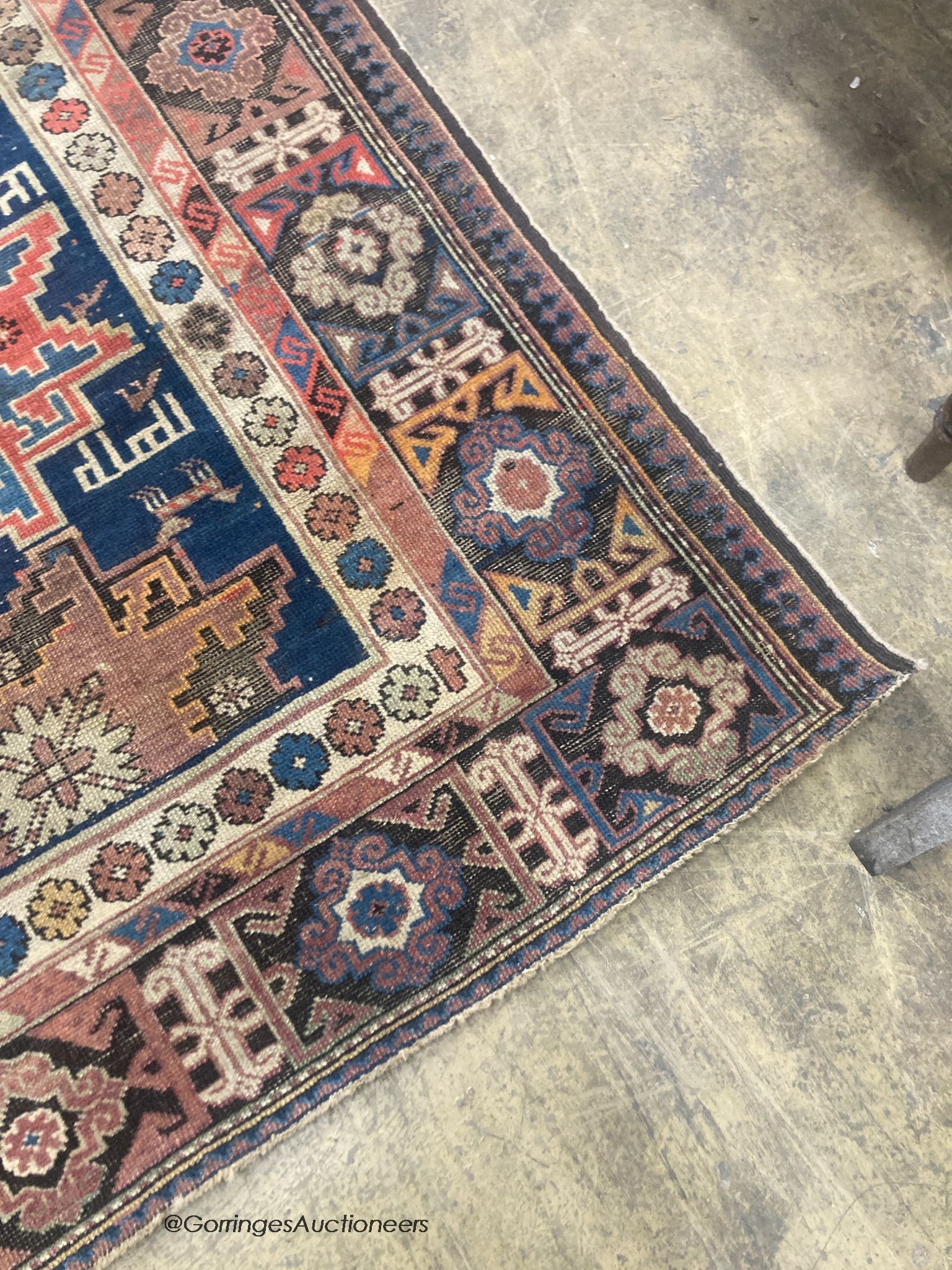 A Caucasian blue ground rug, 155 x 100cm